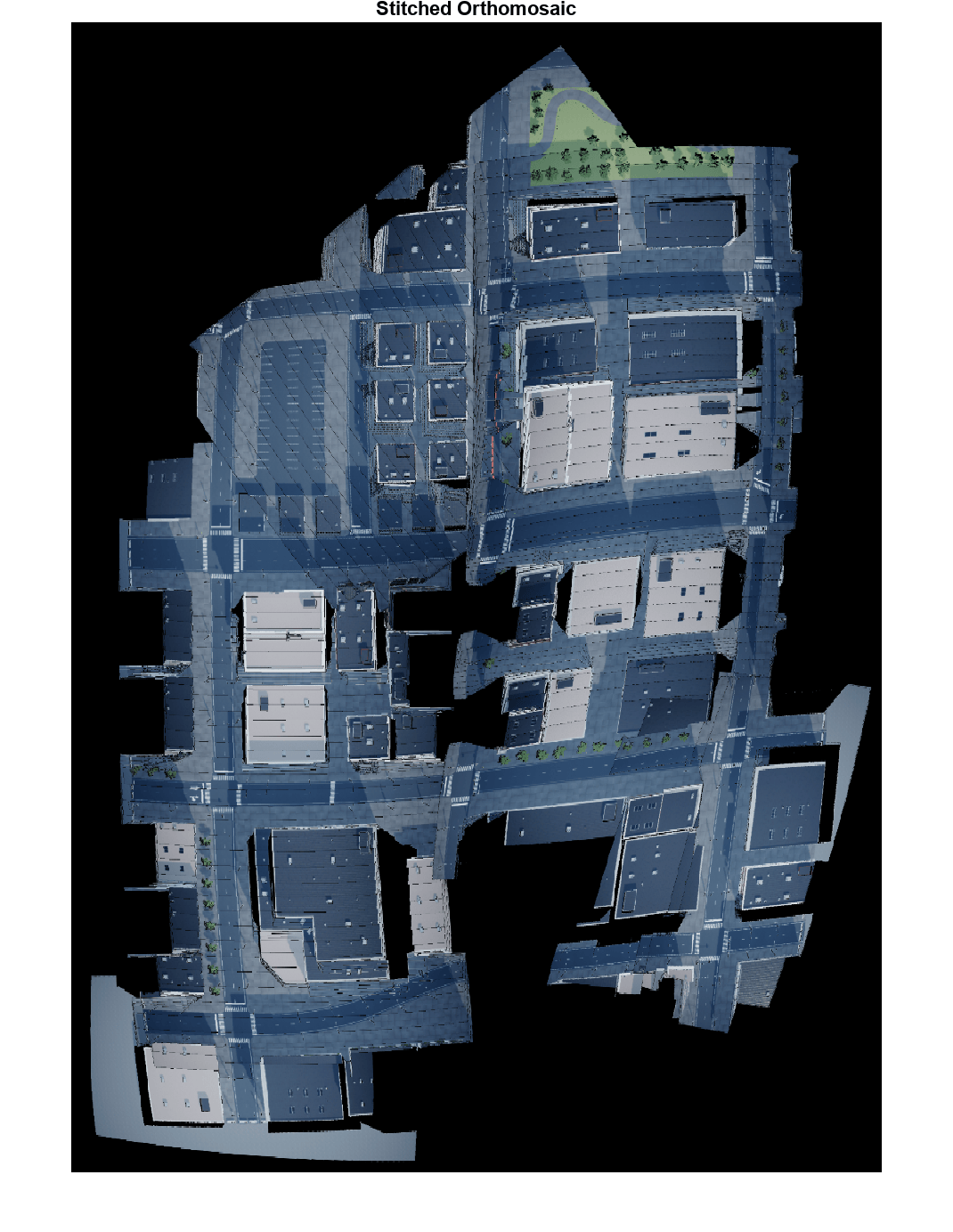 Feature-based stitched orthomosaic of a city block showing buildings, roads, and green spaces assembled from multiple UAV orthophotos