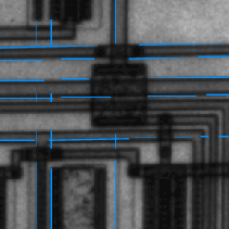 Blue line segments overlaid on a grayscale image of a circuit board